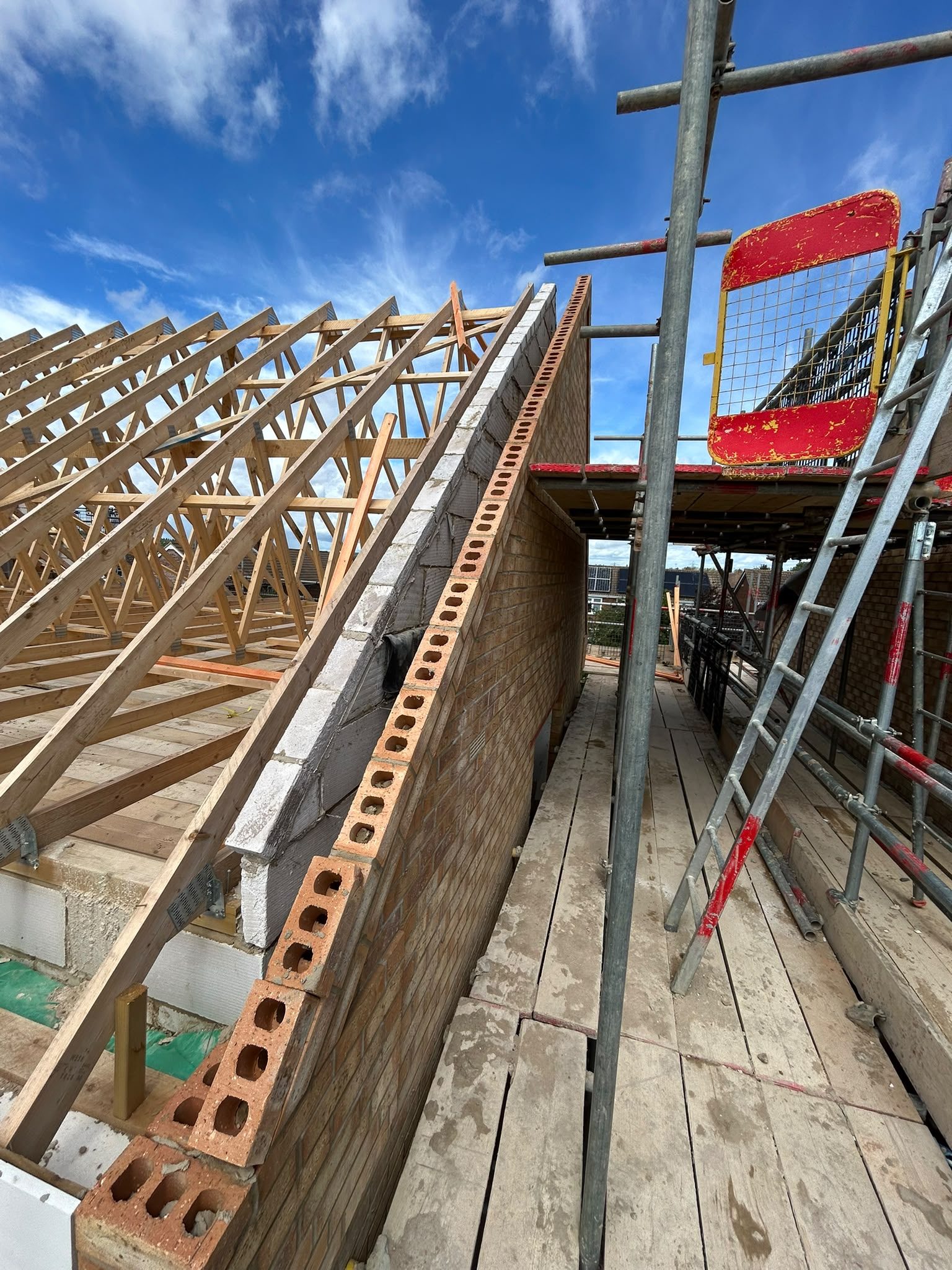 Roof trusses on a topped-out brick gable