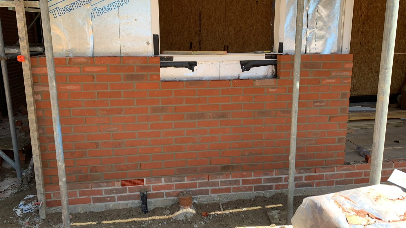 Window opening formed in red facing brick